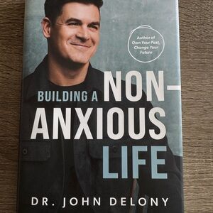 Building a Non-Anxious Life by Dr. John Delony - Black and White Cover